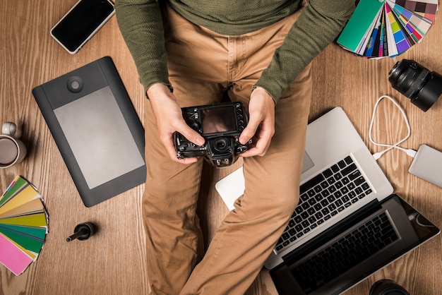 Top view of photographer at workplace with copy space