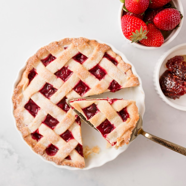 Top view pie and homemade strawberry jam