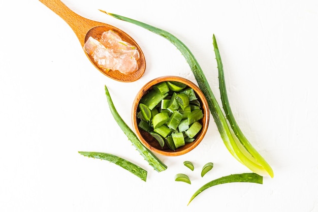 Top view of the pieces of natural aloe vera to make organic gel at home natural cosmetic product white background