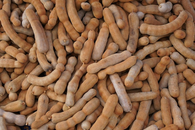 Top view of Pile of ripe Tamarind fruitsSweet ripe tamarinds