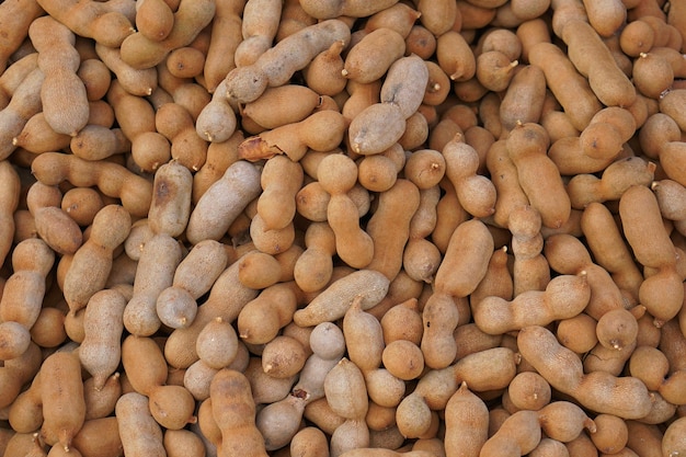 Top view of Pile of ripe Tamarind fruitsSweet ripe tamarinds