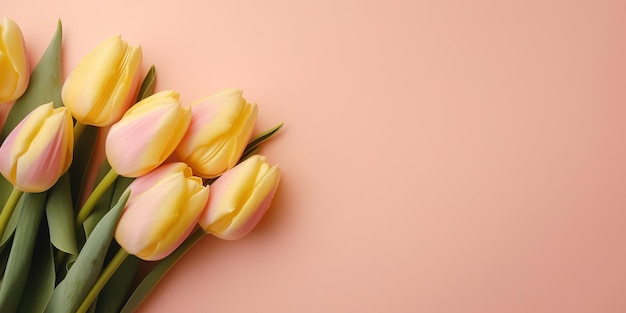 top view pink tulips border on yellow pastel background with copy space