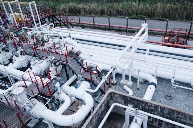 Top view pipe and valve oil flowing into storage tank