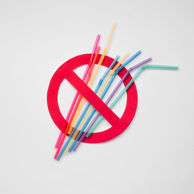 Top view plastic straws pollution sign