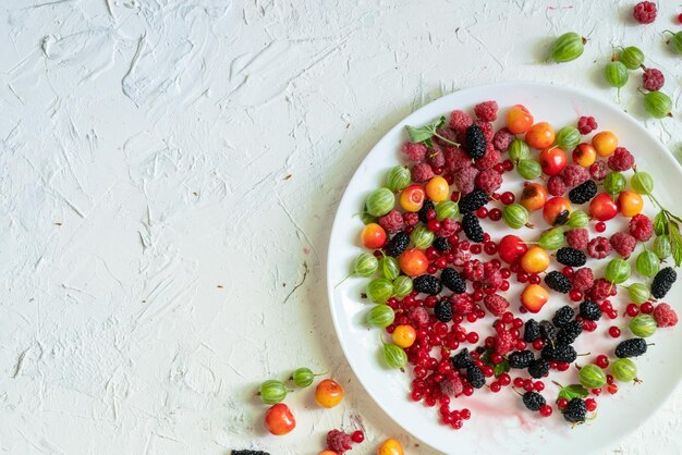 Top view of a plate with lots of fresh raw berry