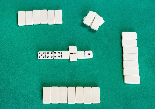 Top view of playfield of dominoes with white tiles