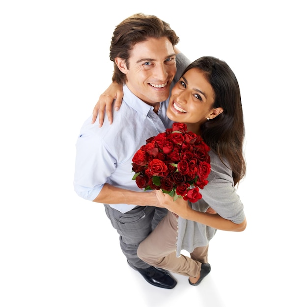 Top view portrait and couple with a bouquet of roses happiness and isolated on white studio background Mockup happy man and woman with flowers floral gift and love for romance loving or bonding