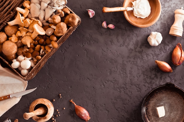 Top view of preparation and frying of edible wild mushrooms