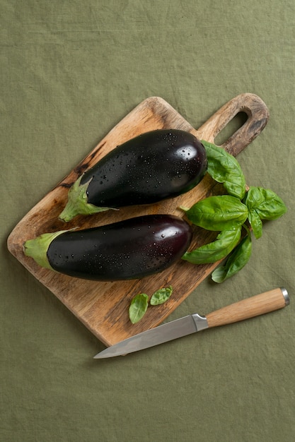 Top view raw eggplants still life