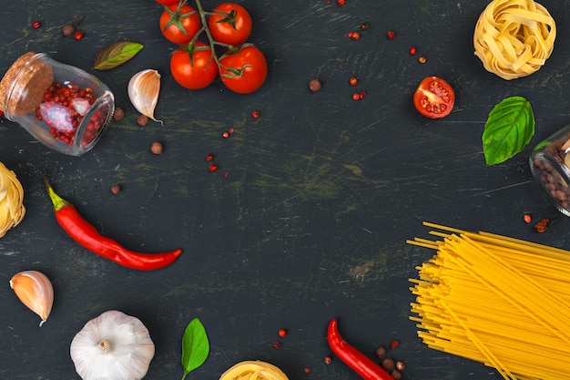 Top view of raw Italian pasta with ingredients