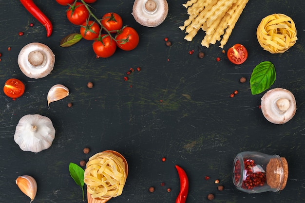 Top view of raw Italian pasta with ingredients