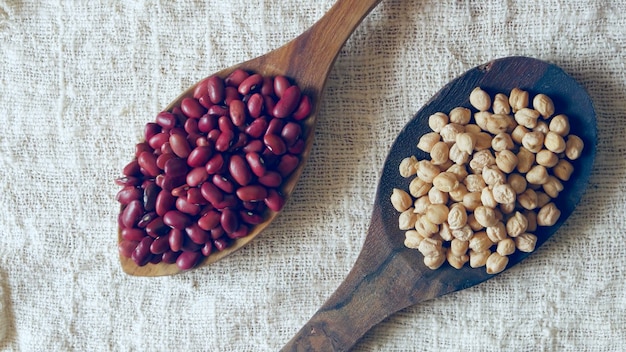 Top view of red kidney beans in wooden spoons