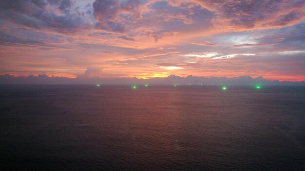 Top view of the red sunset ocean and clouds