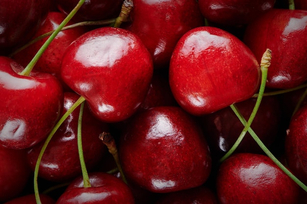 Top view of ripe fresh sweet cherry Sweet cherry Juicy red cherry background with copy space Closeup view Vegan and vegetarian concept Fresh organic berry harvest