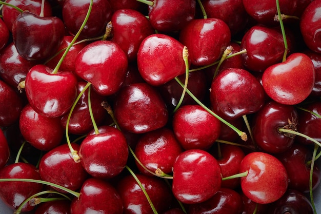 Top view of ripe fresh sweet cherry Sweet cherry Juicy red cherry background with copy space Closeup view Vegan and vegetarian concept Fresh organic berry harvest