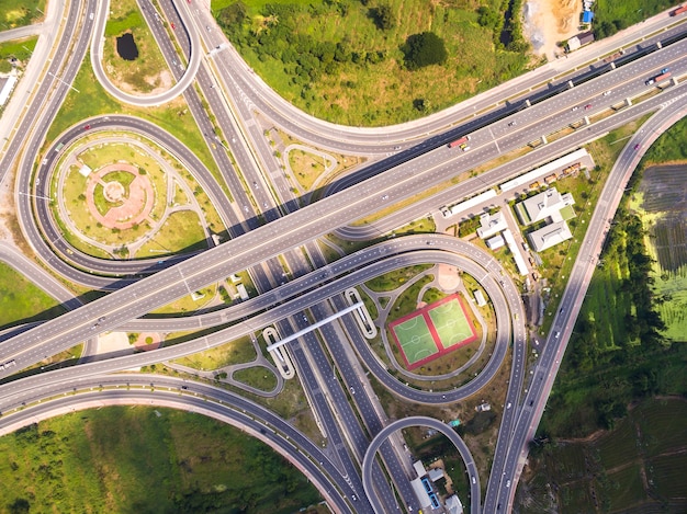 Top view over the road and highway, Aerial shot of highway interchange of a city, Shot fro