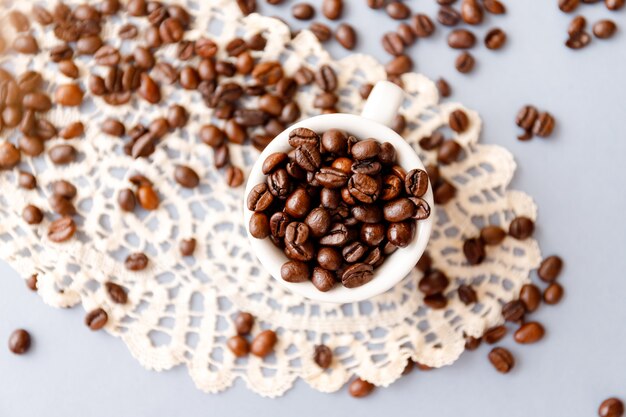 Top view of roasted coffee beans in a mug