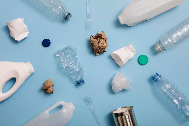 Top view of rubbish for recycling on a blue background