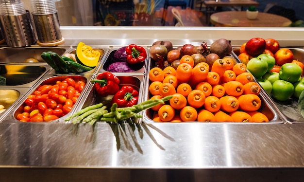 Top view of salad bar with assortment of ingredients for healthy and diet meal.