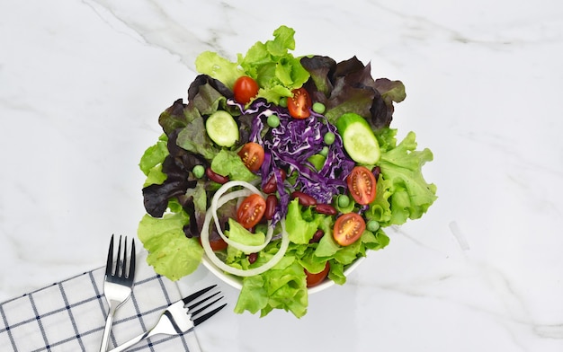 Top view of salad form fresh green leaves mix and vegetables