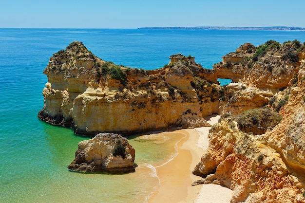 Top view on sandy beach Dos Tres Irmaos(Portimao, Alvor, Algarve, Portugal).