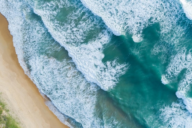 Top View of the Sea texture waves Foaming and Splashing on beach Beautiful wave sea surface background.