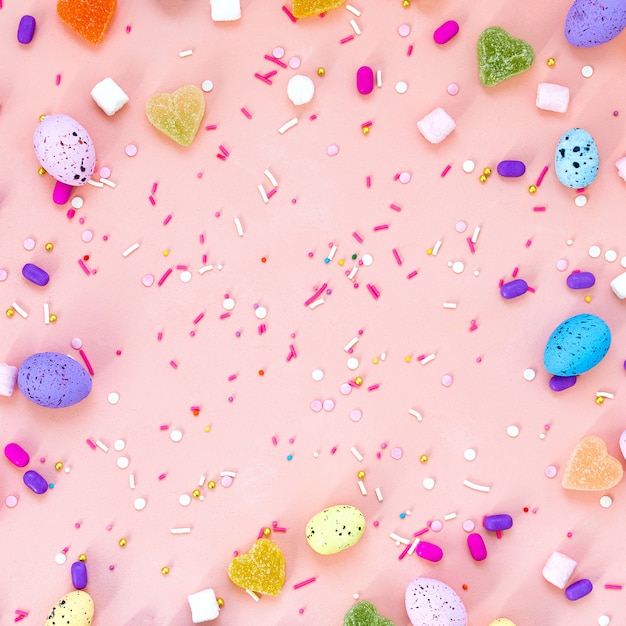 Top view shot of arrangement decoration Happy Easter holiday  concept. Flat lay colorful bunny eggs on beautiful pink desk. Copy space.