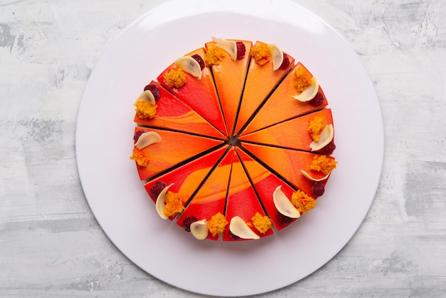 Top view shot of sliced cakes on a white plate