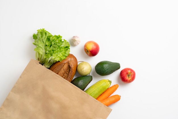 Top view of a simple bag with fresh groceries food, zero waste eco shopping concept