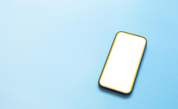 Top view of smartphone with white screen on colorful background