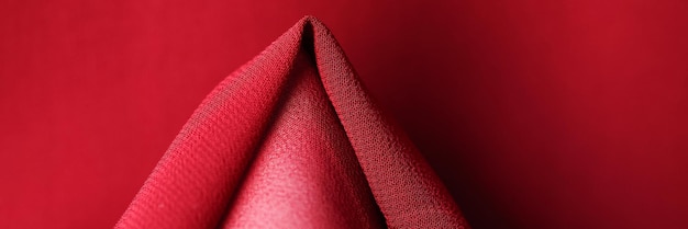 Top view of soft bright ruby textile material textured background natural red fabric surface