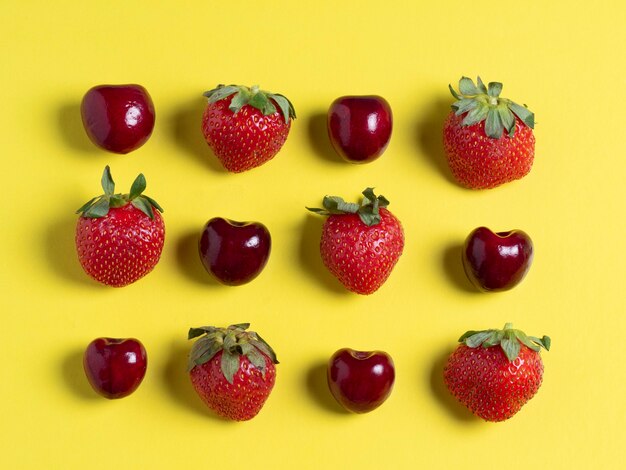 Top view of the square-shaped cherries and strawberries. Healthy food, vegetarian cuisine, fresh fruit, flat lay