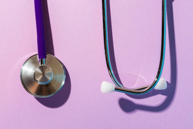 Top view stethoscope on purple background