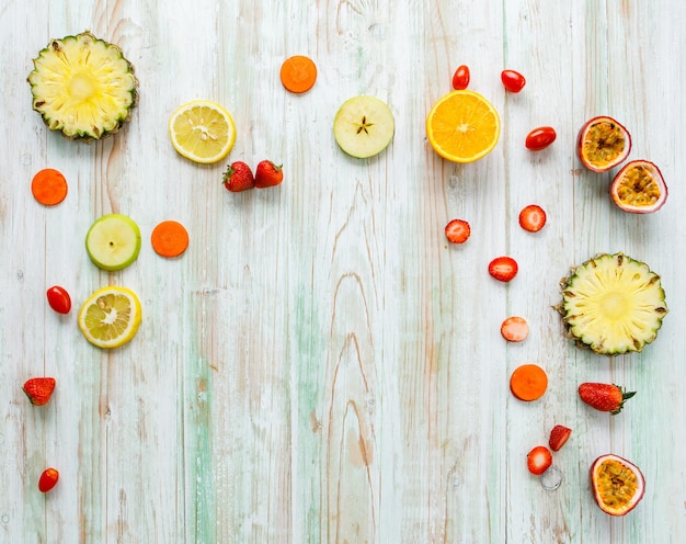 Top view studio shot on wooden table while placing healthy fresh tomatoes and cucumbers for skincare treatment and spa