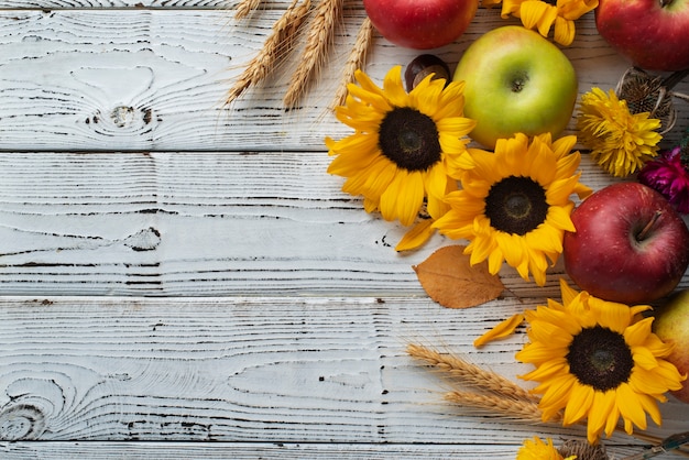 Top view of sunflowers frame with apples