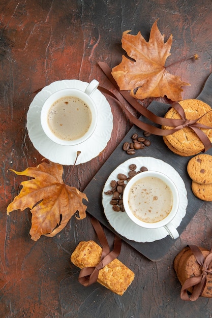 Top view sweet biscuits with cup of coffee on a dark background cookie sweet tea couple love morning color cake