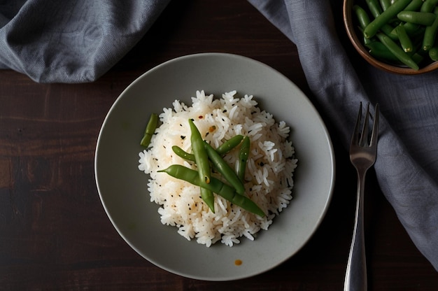 Photo top view tasty boiled rice with green beans inside plate on dark desk