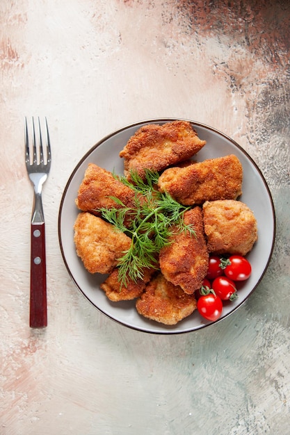 Top view tasty chicken wings with greens and tomatoes on light background meat lunch sandwich food fries burger