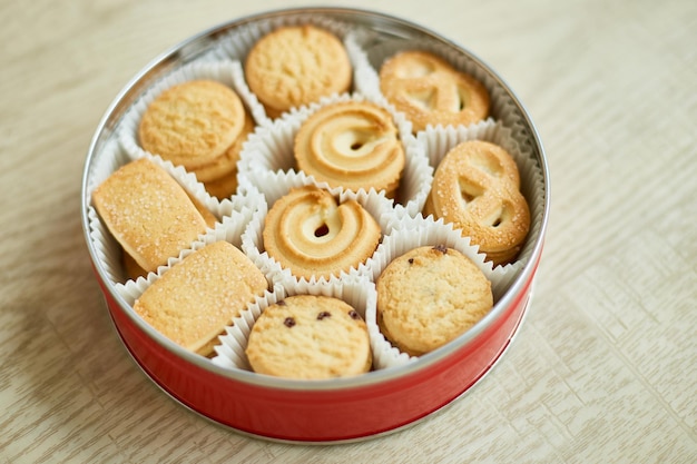 Top view tasty danish butter cookies in a tin box