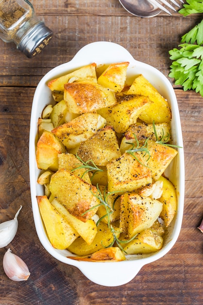 Top view of tasty potatoes on wooden table