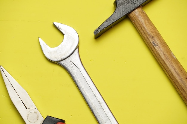 Top view of tools on yellow flat background. repair or maintenance concept. flat lay flat design