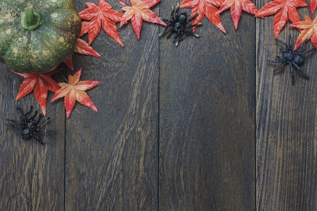 Top view of top ornament Happy Halloween festival background concept.Sign important accessory on the modern rustic brown wooden office desk.Essential item for the holiday.free space creative design.