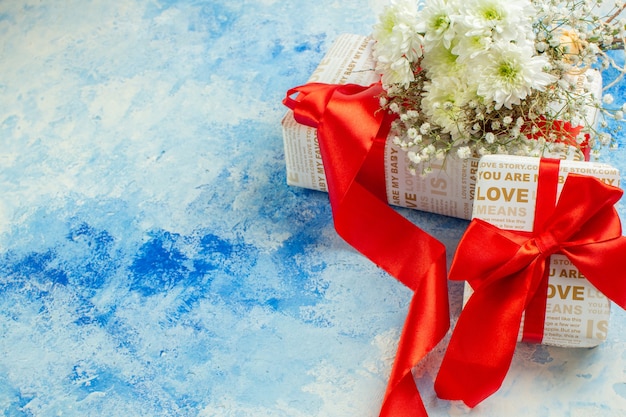 top view valentines day gifts white flowers on blue background free space