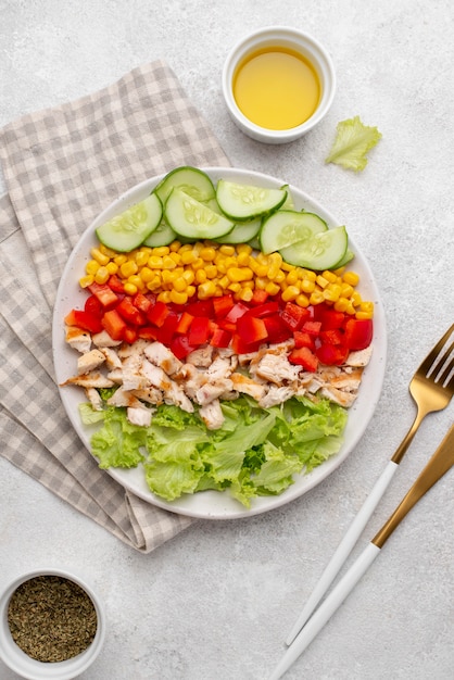 Top view veggie salad with chicken and herbs