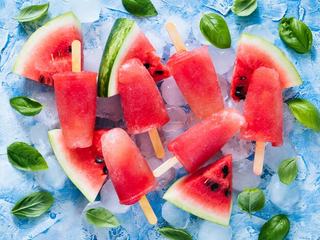 Top view of watermelon and basil popsicles