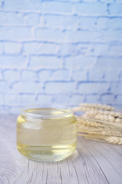 Top view of wheat cooking oil bottle on table