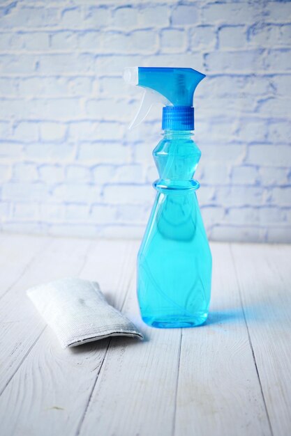 Top view of white color spray bottle on color background