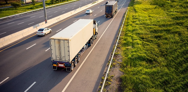 Top view of White Truck motion blur on highway road with container, transportation concept.