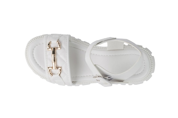 Top view of a white women's sandal with a gold clasp