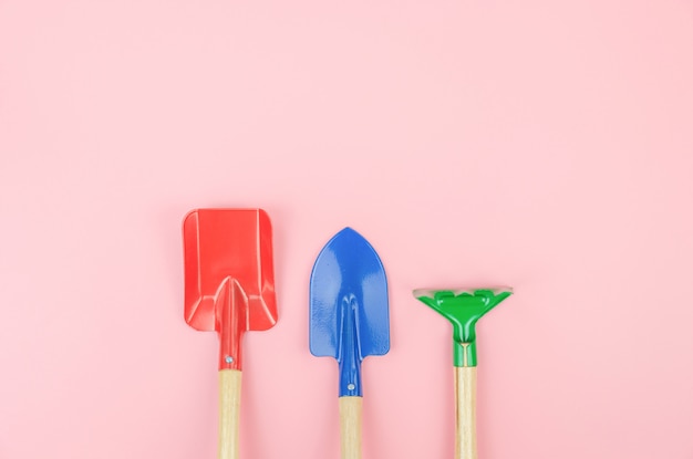 Top view with  of Gardener tools overhead on pink pastel background, Flat lay 